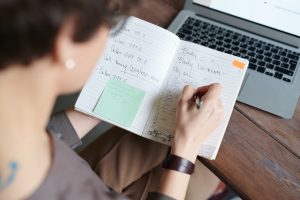 A woman taking business notes