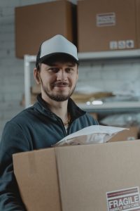 Man moving boxes moving business